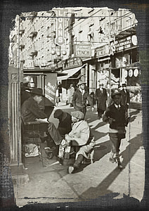 grayscale photography of man sitting on chair thumbnail
