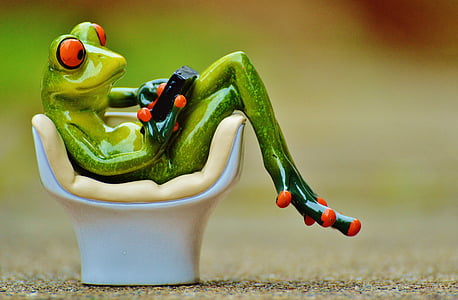 green frog figurine during daytime thumbnail