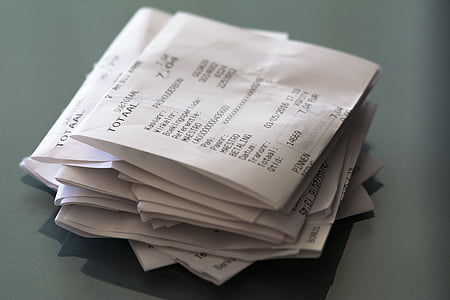 business receipt lot fold on gray surface thumbnail