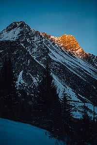 mountain alps under blue sky thumbnail