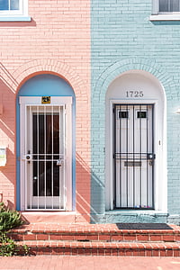 pink and blue brick buildings with metal doors thumbnail