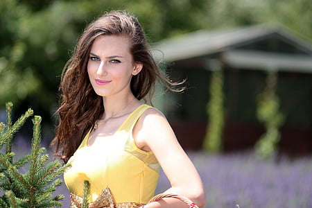 woman wearing yellow sleeveless dress thumbnail