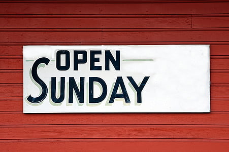 Open Sunday signage on red steel bar thumbnail