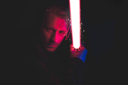 photo of man holding light saber thumbnail