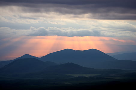 silhouette of mountain with ray of lights thumbnail