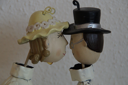 man and woman doll kissing thumbnail