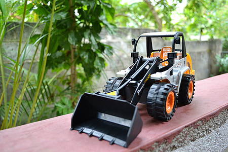 shallow focus photography of payloader toy thumbnail