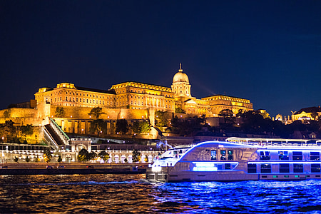 beige cathedral near body of water during nighttime thumbnail