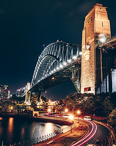 brown and gray concrete bridge at nighttime thumbnail