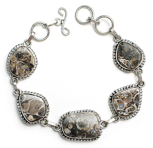 close up of beaded black and silver-colored chain charm bracelet thumbnail