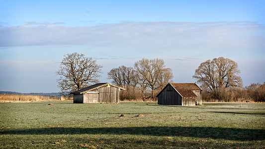 two brown wooden houses thumbnail