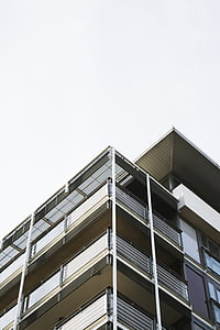 low angle photography of brown concrete building thumbnail