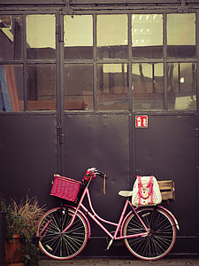 pink step through bike leaning on gate thumbnail