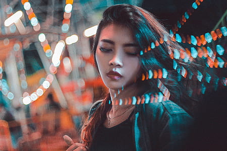 woman in black and gray top in bokeh photography thumbnail