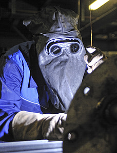 person wearing blue jacket and black mask thumbnail