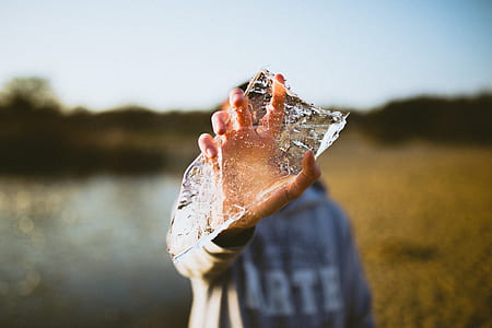 person holding ice in field thumbnail