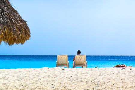 man sitting on white lounge chair thumbnail