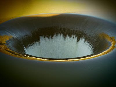 water flowing down in hole thumbnail