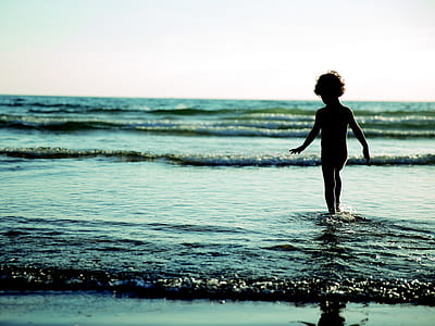 toddler walking on body of water thumbnail