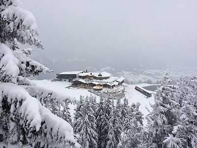 snow capped brown house on mountain thumbnail