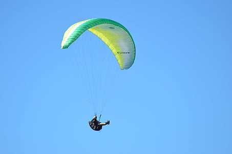 person paraglider under blue sky thumbnail