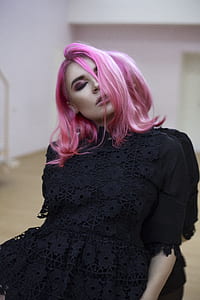 closeup photo of woman leaning on mirror wearing black shirt thumbnail