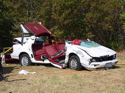 crashed white car near tree thumbnail