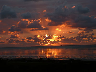 beach under pale evening sky thumbnail