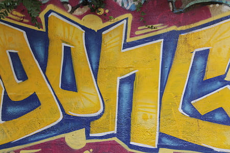 yellow and blue graffiti closeup photo thumbnail