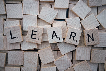 scrabble chip with learn text over lay thumbnail