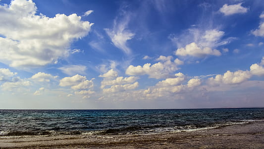 photography of shore under calm sky thumbnail
