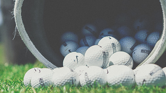 selective focus photograph of golf balls thumbnail