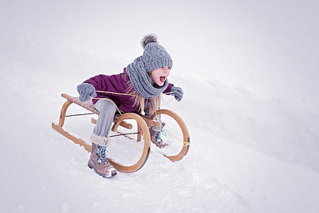 girl riding sled thumbnail