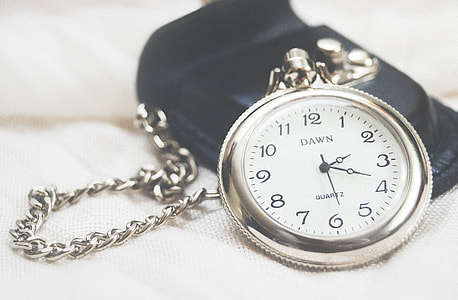 round silver-colored Dawn Quartz pocket watch at 2:19 thumbnail