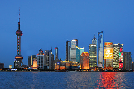 Shanghai skyline beside body of water thumbnail