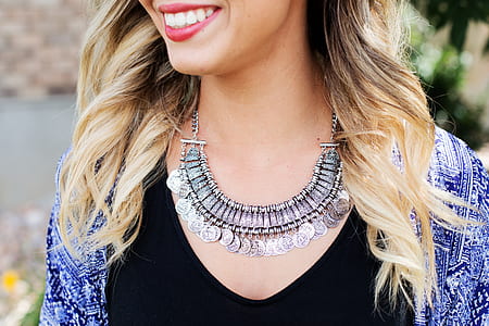 woman wearing silver-colored necklace thumbnail