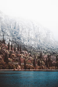 body of water near mountain thumbnail
