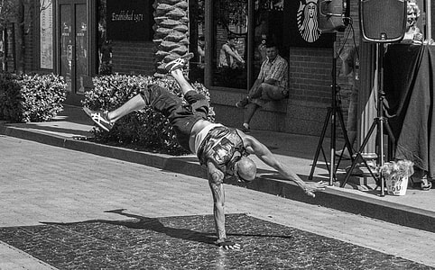 grayscale photo of man breakdancing thumbnail