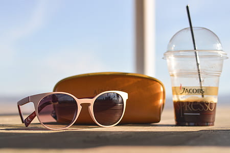 black sunglasses on floor near brown wallet thumbnail
