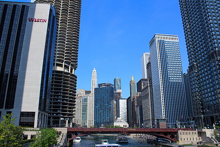 high rise buildings under clear blue sky thumbnail