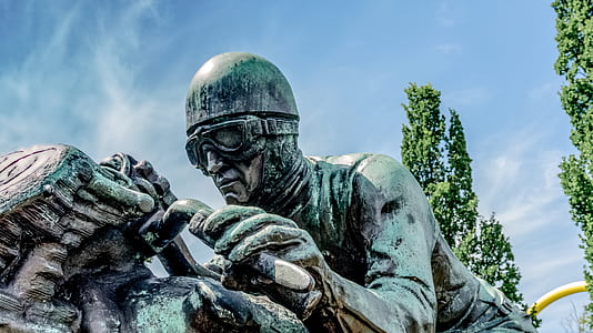 man riding motorcycle statue thumbnail