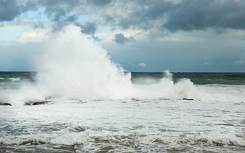 time lapse photography of water splash under cloudy sky thumbnail