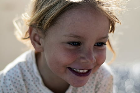 toddler in white shirt in bokeh photograph thumbnail