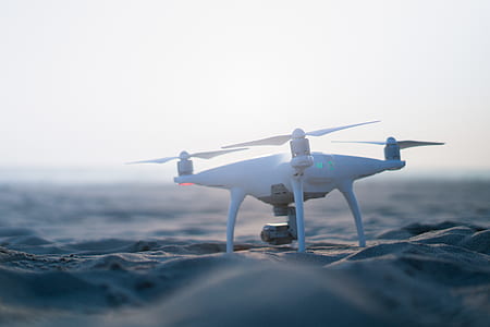 white drone on sand in macro photography thumbnail
