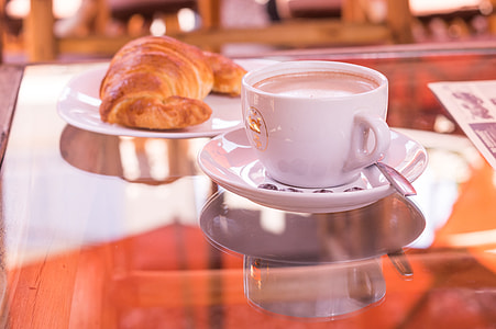 round white ceramic teacup and saucer thumbnail