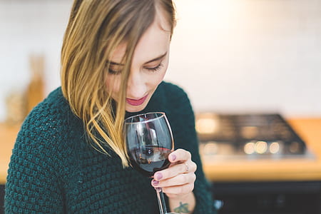 photo of woman holding wine glass thumbnail