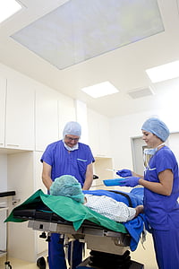 man and woman wearing blue scrub top with pants thumbnail