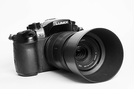black Lumix DSLR camera in closeup photography thumbnail