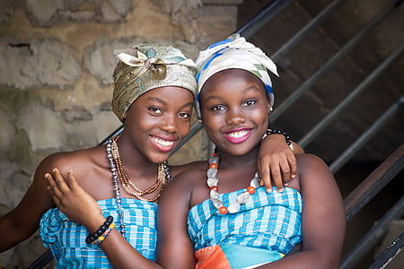 two women wearing blue and white shirts thumbnail