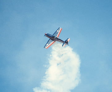 blue and red plane on sky thumbnail